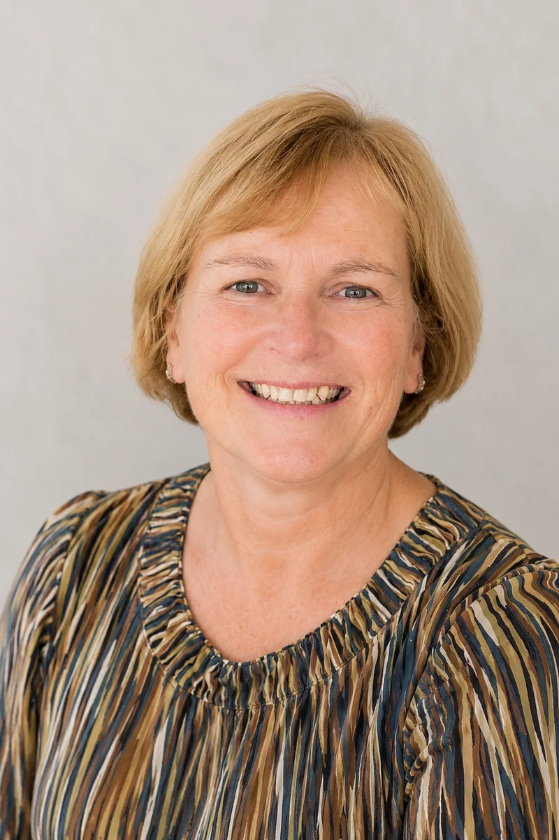 Headshot of Teresa Loos-Tedrow, Leader and Co-Owner of TEDDYco Media, smiling at the camera