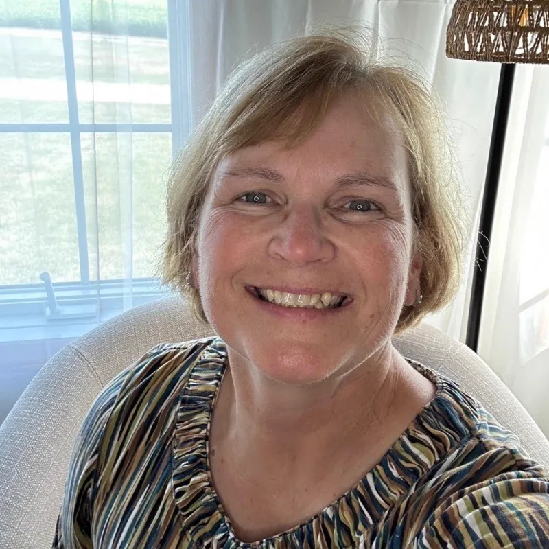 Headshot of Teresa Loos-Tedrow, Leader and Co-Owner of TEDDYco Media, smiling at the camera